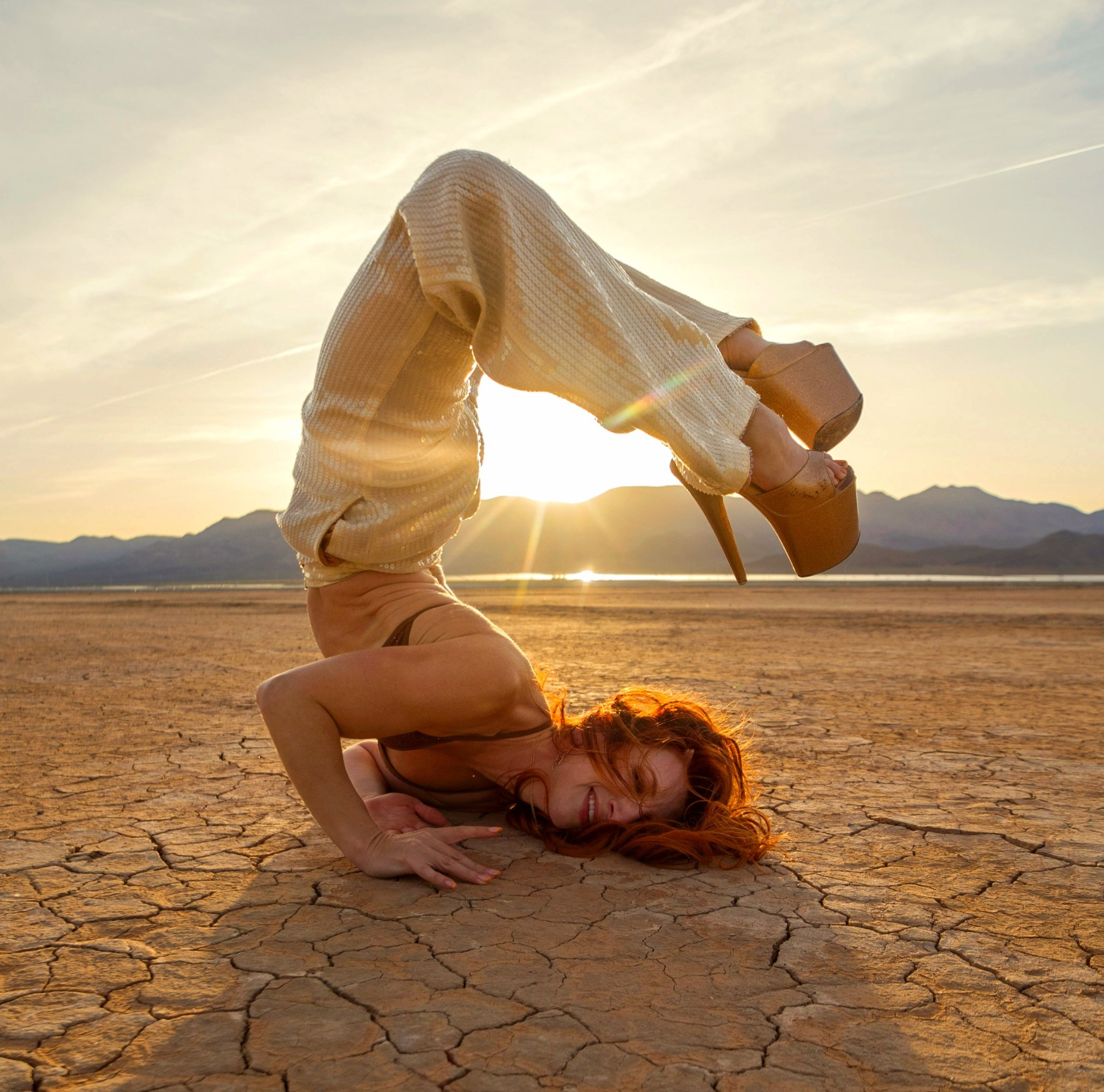 California Andrea dancing on a pole in the desert at golden hour